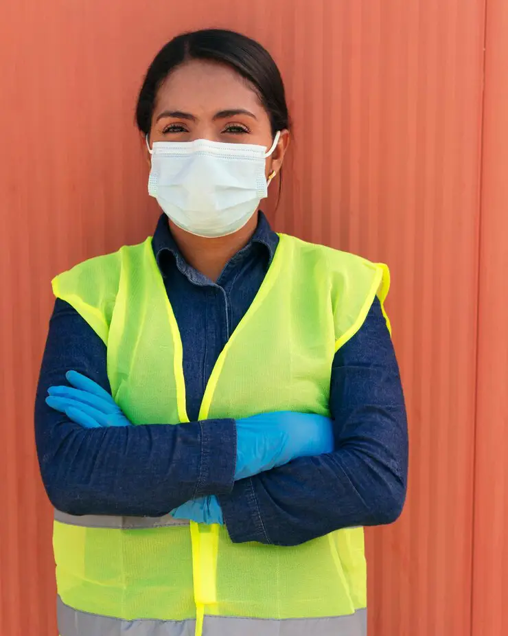 running this site with confidence cropped portrait attractive young female construction worker standing with her arms folded site_590464 59443 4